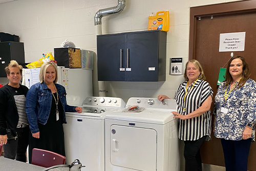 Sedalia WSL donating a washer and dryer to Smith-Cotton High School