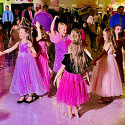 girls in pink dresses on the dance floor